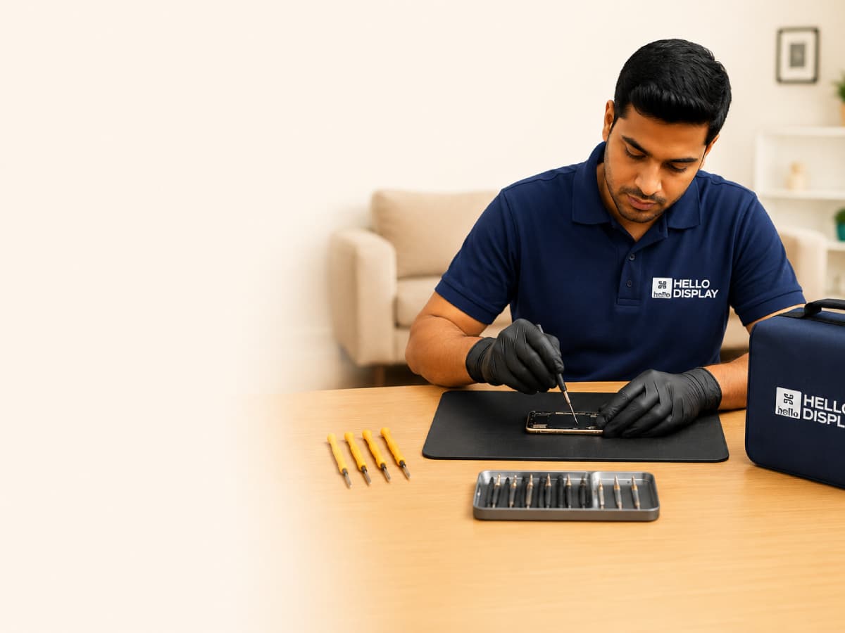 Technician repairing a mobile phone at a customer's home